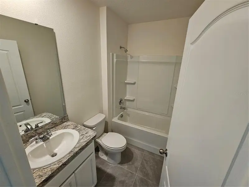 Furnished interior view inside a new home in Charles Cove Express, Davenport (Image 4).