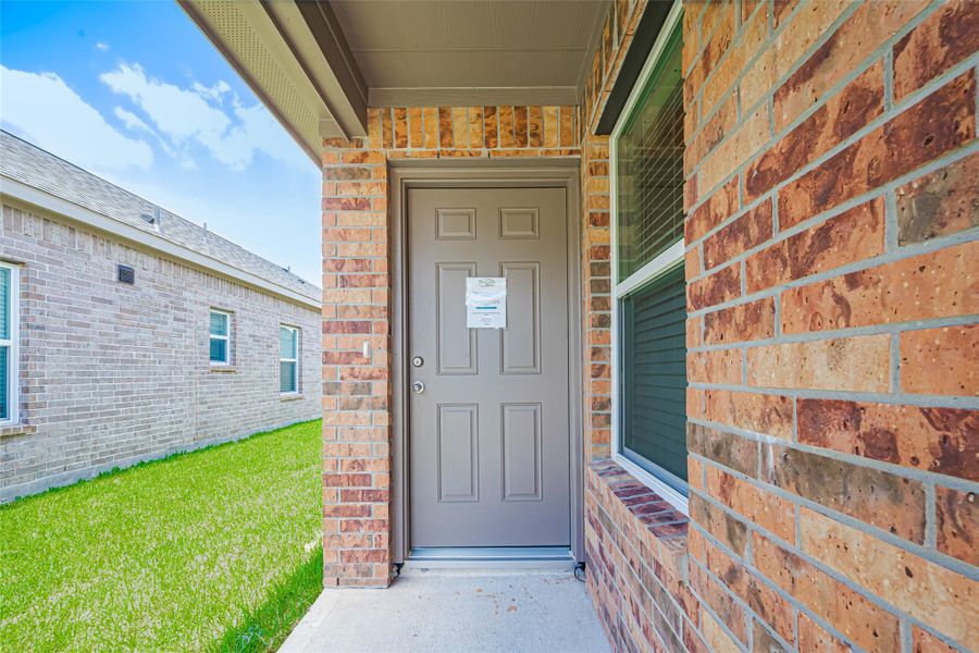 Exterior details and patio area of a home in Sunterra, Katy (Image 3).
