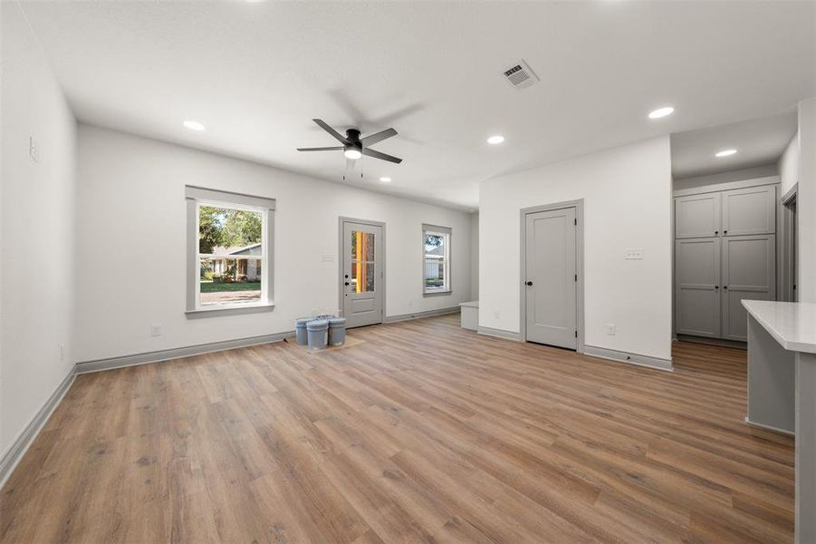 Unfurnished living room with recessed lighting, light wood-style flooring, and a ceiling fan