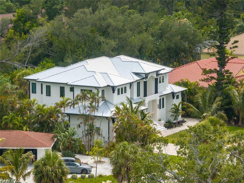 Front exterior of a new home in , Longboat Key, FL, highlighting curb appeal (Image 31). Front exterior of a new home in , Longboat Key, FL, highlighting curb appeal (Image 31).