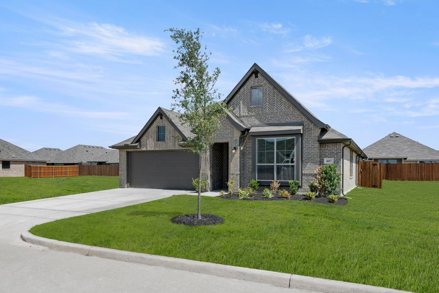 Front exterior of a new home in Pirate Village, Granbury, TX, highlighting curb appeal (Image 2). Front exterior of a new home in Pirate Village, Granbury, TX, highlighting curb appeal (Image 2).