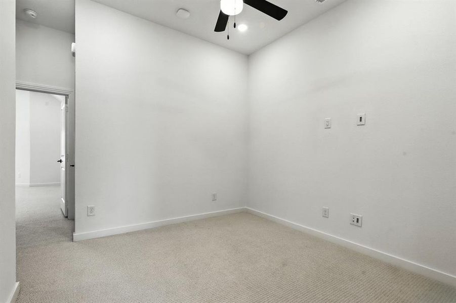 Empty room with light carpet, ceiling fan, and recessed lighting Empty room with light carpet, ceiling fan, and recessed lighting