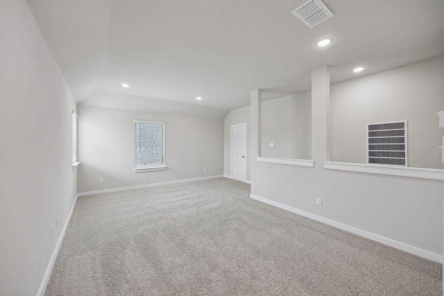 Game Room in the Stanley II home plan by Trophy Signature Homes – REPRESENTATIVE PHOTO