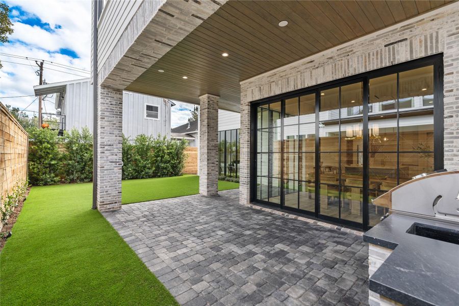 The Pavilion looks over a turfed  yard with landscaping for privacy.