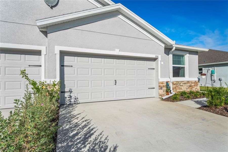 Exterior details and patio area of a home in Towns at Woodsdale, Wesley Chapel (Image 26).