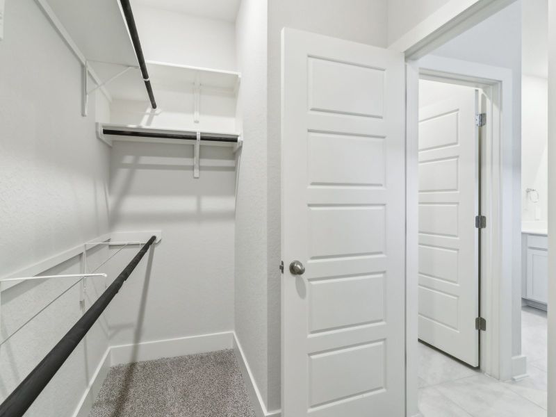Primary suite walk-in closet in the San Saba floorplan at a Meritage Homes community.