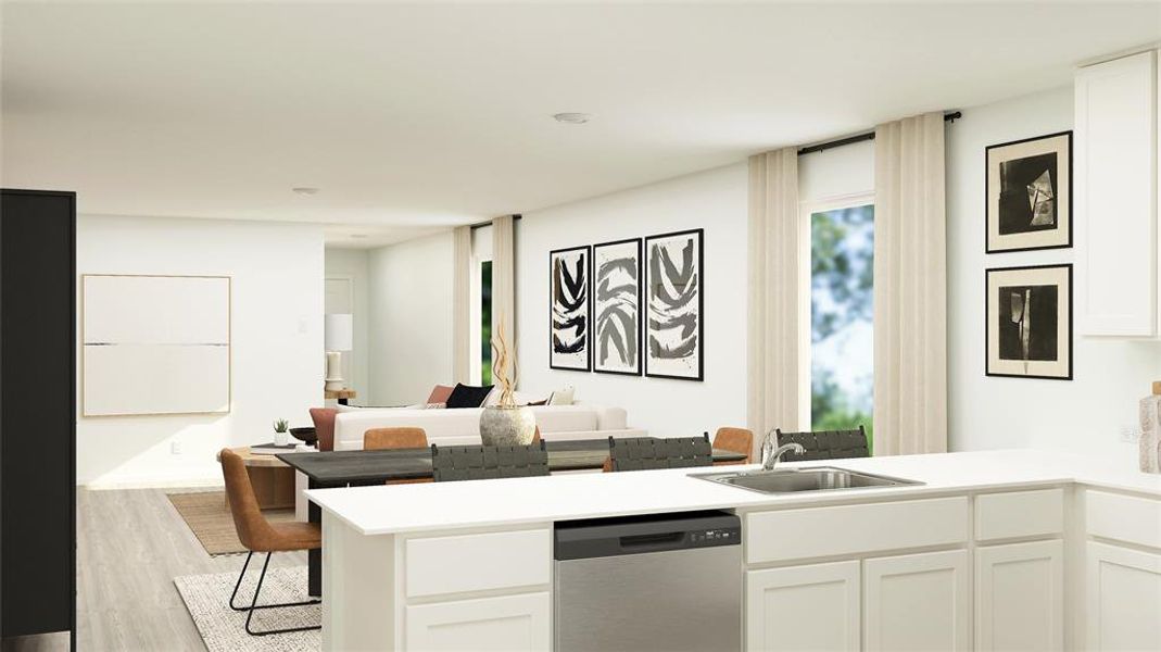 Kitchen with kitchen peninsula, light wood-type flooring, white cabinets, sink, and dishwasher