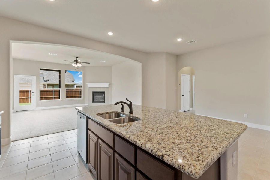 Kitchen to Family Room | Concept 2795 at Redden Farms - Classic Series in Midlothian, TX by Landsea Homes