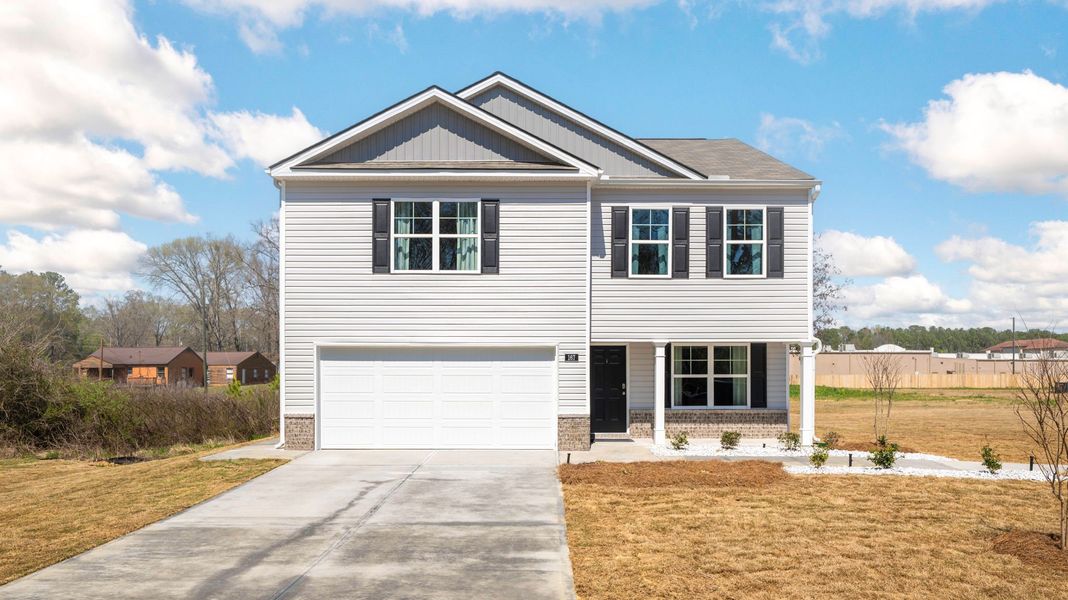 Front exterior of a new home in Powell Meadows, Cleveland, TN, highlighting curb appeal (Image 1). Front exterior of a new home in Powell Meadows, Cleveland, TN, highlighting curb appeal (Image 1).