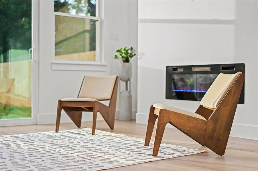 Sitting room with light wood-type flooring