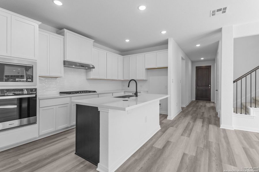 Furnished interior view inside a new home in Ladera 50', San Antonio (Image 10).