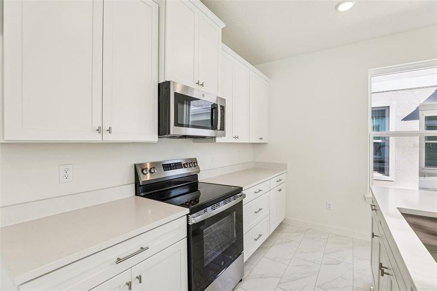 Furnished interior view inside a new home in Trinity Place, St. Cloud (Image 3).