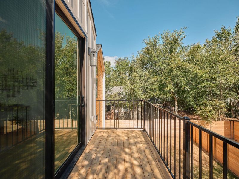 Balcony featuring view of scattered trees Balcony featuring view of scattered trees