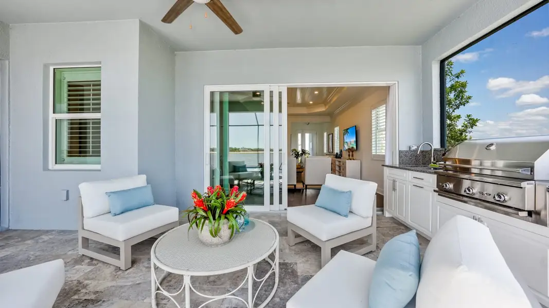 Exterior details and patio area of a home in SkySail, Naples (Image 4).