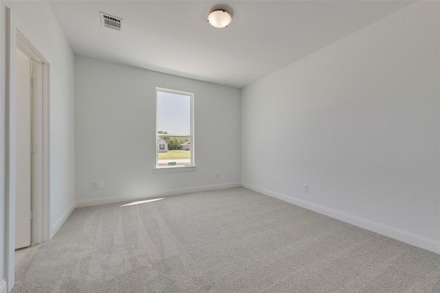 Empty room with carpet floors