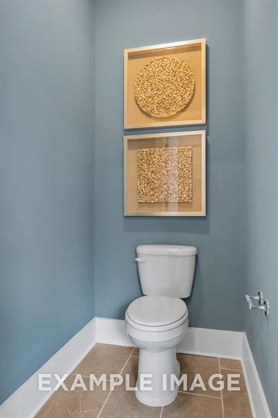 Bathroom with tile patterned flooring and toilet