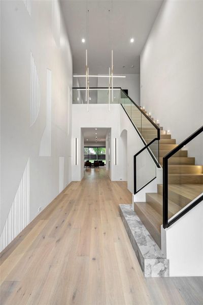 A modern, spacious foyer with high ceilings and sleek design.