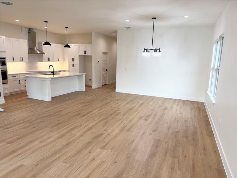 An open floorplan seamlessly connects the well-appointed kitchen with an inviting living space. An open floorplan seamlessly connects the well-appointed kitchen with an inviting living space.