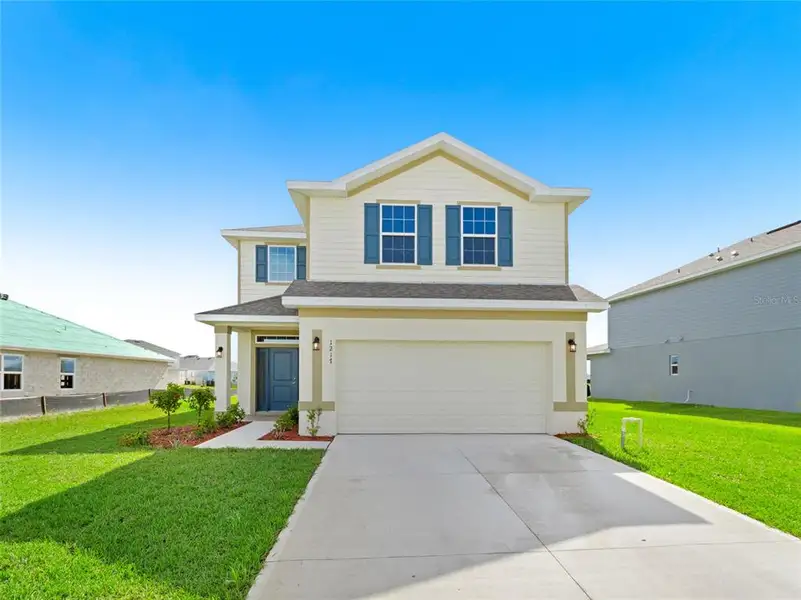 Front exterior of a new home in , Palm Bay, FL, highlighting curb appeal (Image 1). Front exterior of a new home in , Palm Bay, FL, highlighting curb appeal (Image 1).