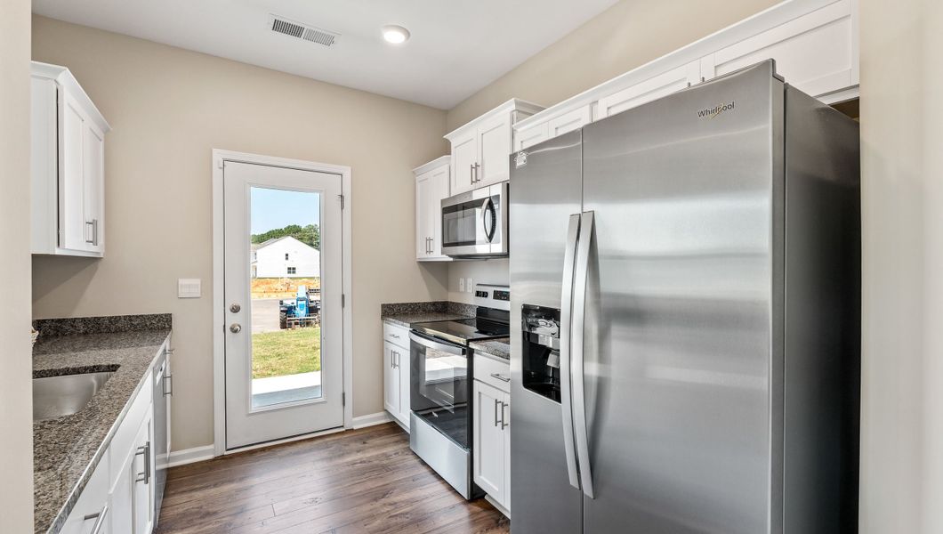 Furnished interior view inside a new home in Tanglewood Townes, Greenville (Image 11).