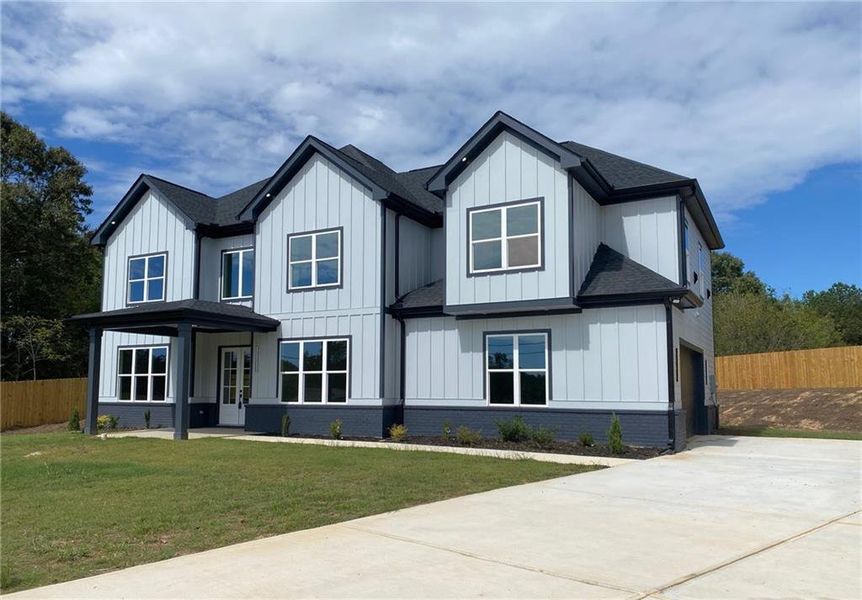 Front exterior of a new home in , Snellville, GA, highlighting curb appeal (Image 1).