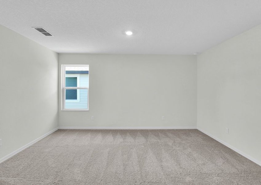 Rest and relaxation await in the master bedroom