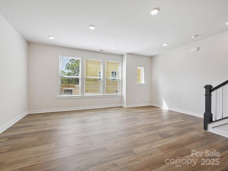 Spacious, unfurnished interior of a new home in Central Living at Craig, Charlotte (Image 14).