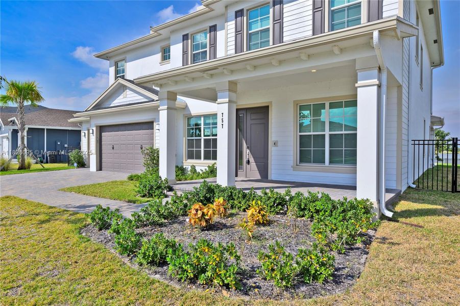 Exterior details and patio area of a home in Arden: The Waterford Collection, Loxahatchee (Image 30).