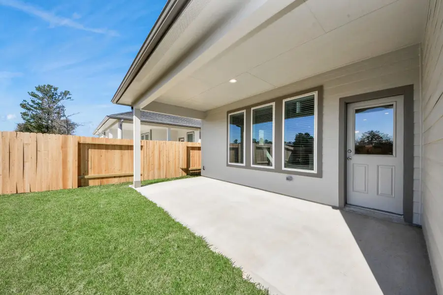 Experience outdoor living at its finest on this expansive covered patio, thoughtfully designed for BBQs and delightful outdoor dining. Sample photo of completed home with similar floor plan. Actual colors and selections may vary. Experience outdoor living at its finest on this expansive covered patio, thoughtfully designed for BBQs and delightful outdoor dining. Sample photo of completed home with similar floor plan. Actual colors and selections may vary.