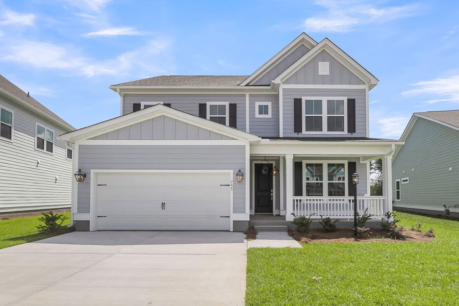 Front exterior of a new home in Tidewater at Lakes of Cane Bay, Summerville, SC, highlighting curb appeal (Image 2). Front exterior of a new home in Tidewater at Lakes of Cane Bay, Summerville, SC, highlighting curb appeal (Image 2).