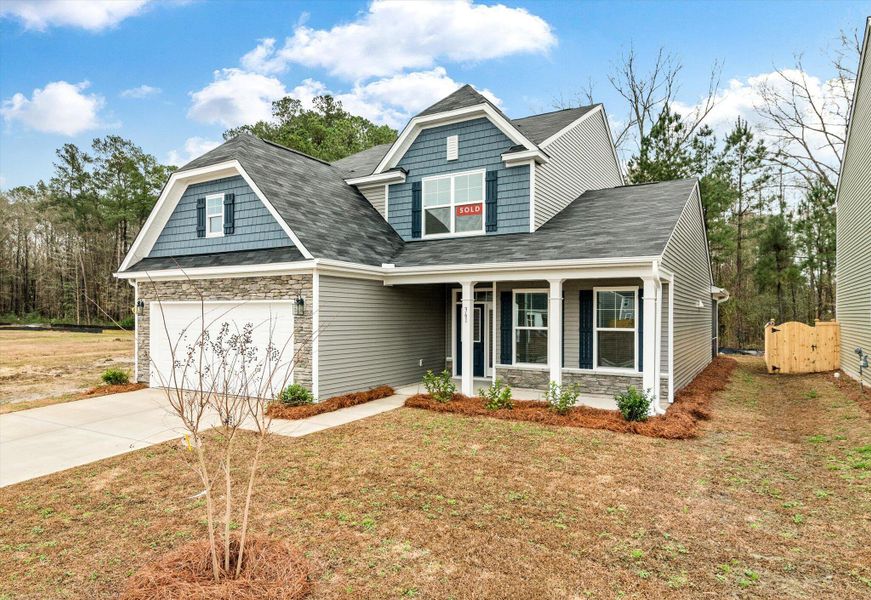 Front exterior of a new home in Oakley Pointe, Moncks Corner, SC, highlighting curb appeal (Image 2).