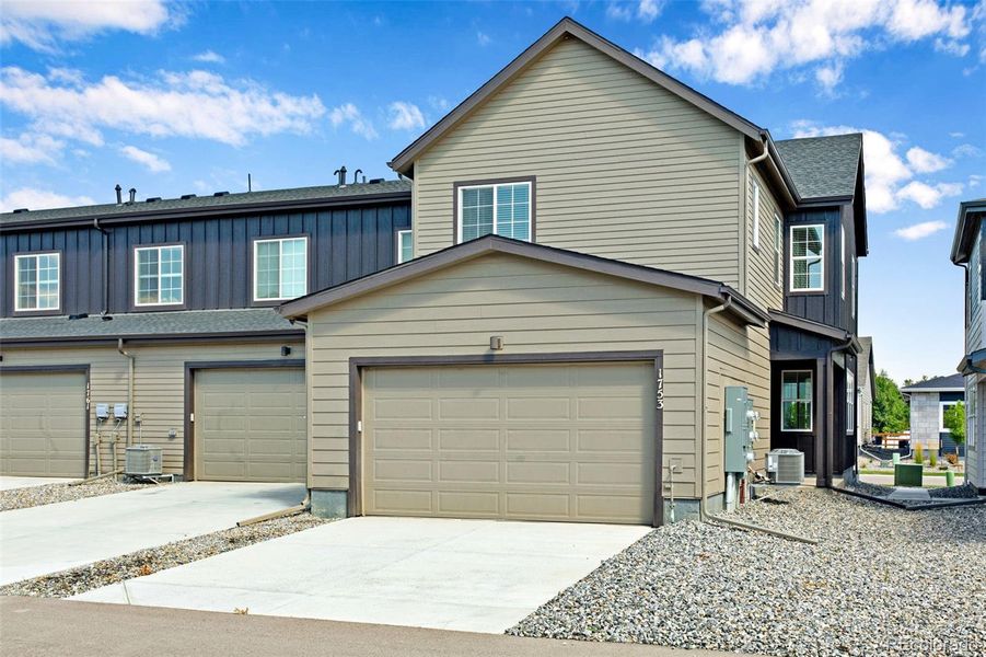 Front exterior of a new home in , Berthoud, CO, highlighting curb appeal (Image 24).