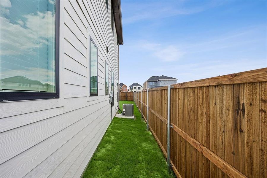 Exterior details and patio area of a home in Fields - East Village, Frisco (Image 20).