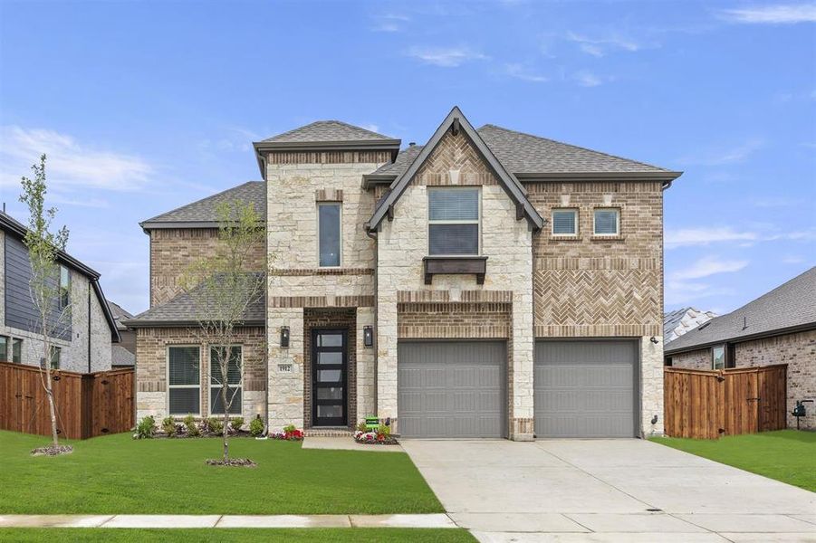 Front exterior of a new home in Las Lomas, Forney, TX, highlighting curb appeal (Image 1).
