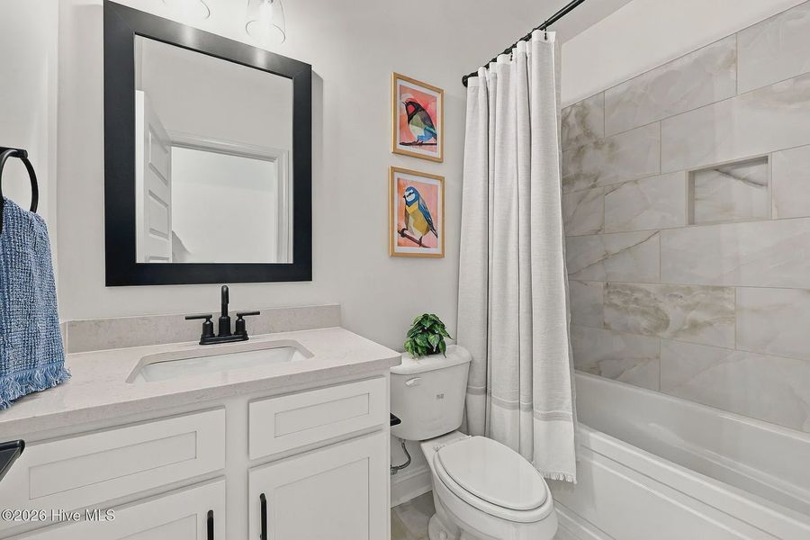 Furnished interior view inside a new home in Dixon Grove, Grimesland (Image 5).
