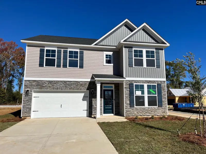 Front exterior of a new home in Blythewood Farms, Blythewood, SC, highlighting curb appeal (Image 1). Front exterior of a new home in Blythewood Farms, Blythewood, SC, highlighting curb appeal (Image 1).