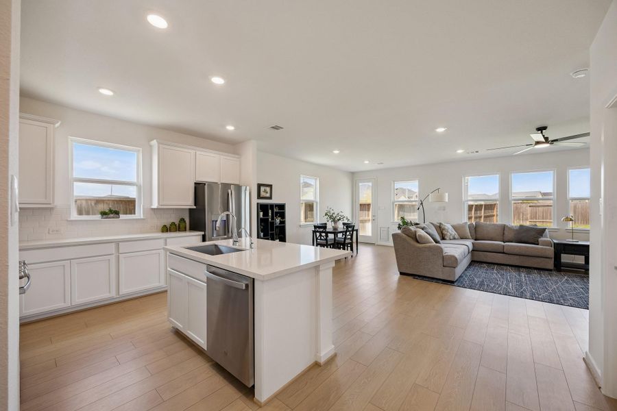 Such a wonderful open flow from the Kitchen to the Den and Dining Area.
