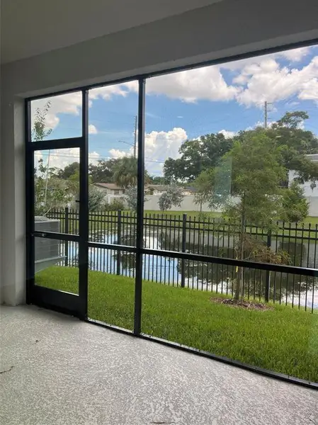 Exterior details and patio area of a home in The Towns At Long Bayou, Seminole (Image 3).