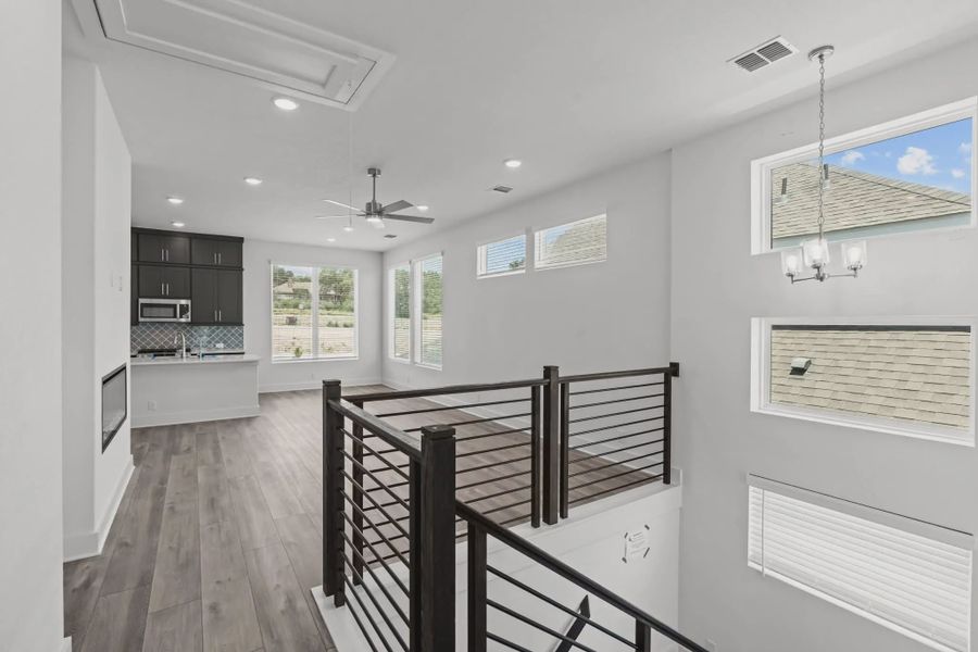Representative furnished interior of a home built from the Athena by Chesmar Homes in Prominence Urban, San Antonio (Image 6).