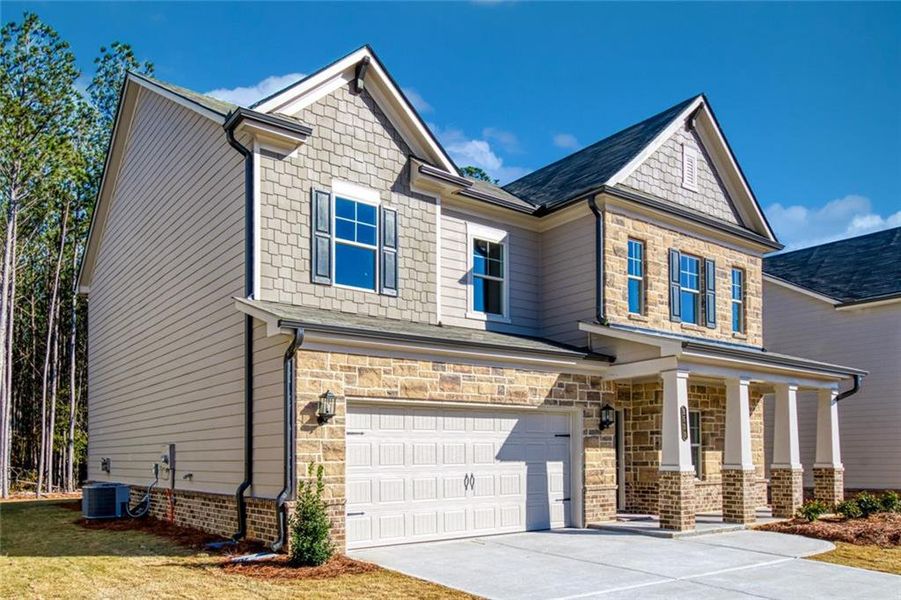 Front exterior of a new home in Enclave at Logan Point, Loganville, GA, highlighting curb appeal (Image 1).