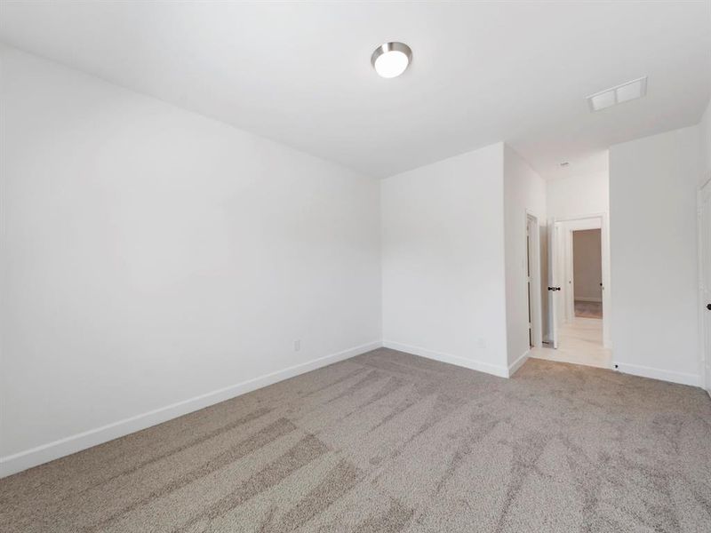 The adjourning second, secondary bedroom with access to the Jack-In-Jill style bathroom. (Sample photos of a completed Warwick floor plan. The image may feature alternative selections and/or upgrades.)