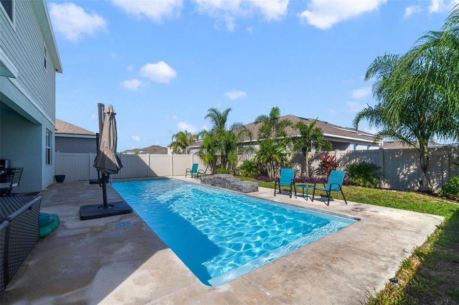 Pool overlooks a fully fenced backyard!