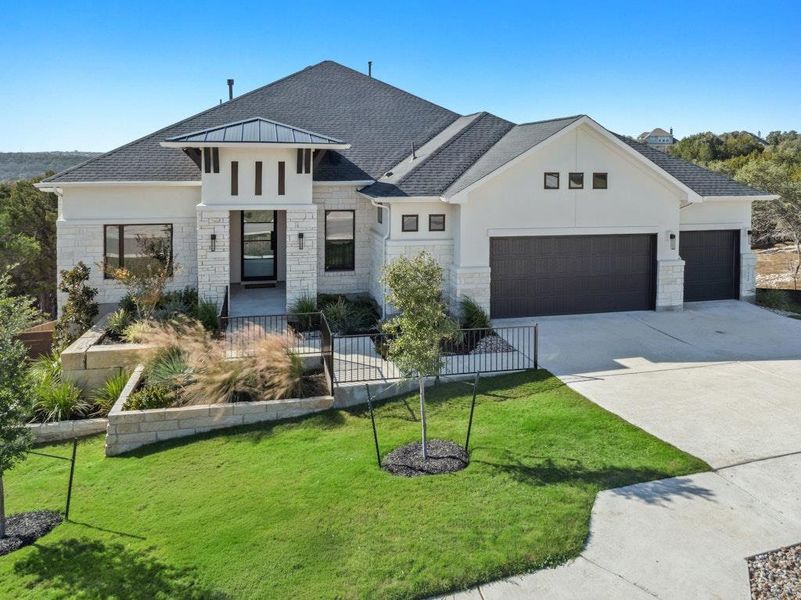 Front exterior of a new home in Riverstone, Georgetown, TX, highlighting curb appeal (Image 18).