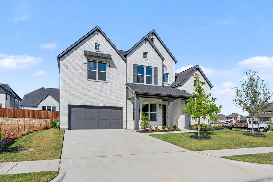 Front exterior of a new home in Quail Hollow, Rockwall, TX, highlighting curb appeal (Image 24).