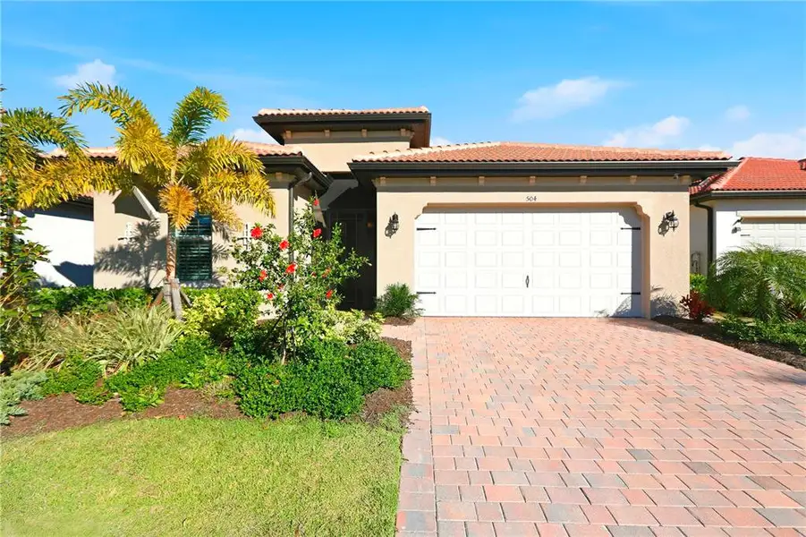 Front exterior of a new home in , Nokomis, FL, highlighting curb appeal (Image 2). Front exterior of a new home in , Nokomis, FL, highlighting curb appeal (Image 2).