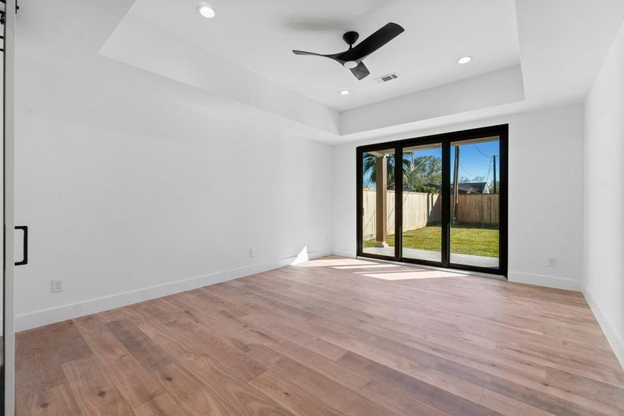 The master bedroom is spacious enough with its access through the sliding door to the covered patio in the backyard