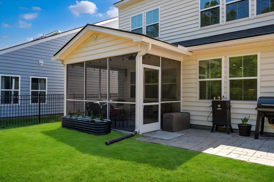 Exterior details and patio area of a home in , Johns Island (Image 27).