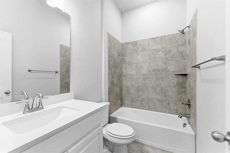 Bathroom featuring shower / bathtub combination and vanity