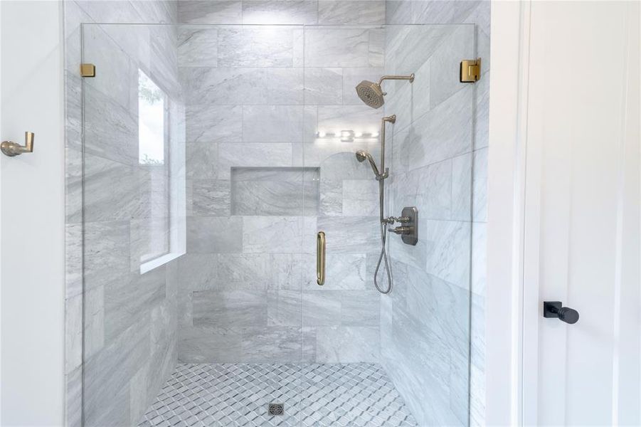 Full bathroom featuring a stall shower