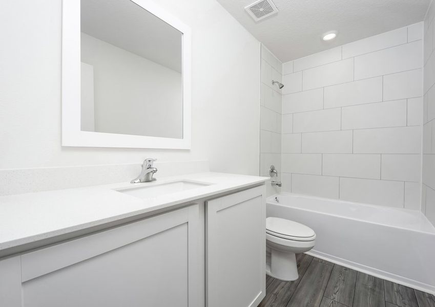 Secondary bathroom with tile detail